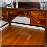 F26. Chippendale style desk with glass top. Some minor chips on edge. 32”h x 57”w x 28”d - $250
